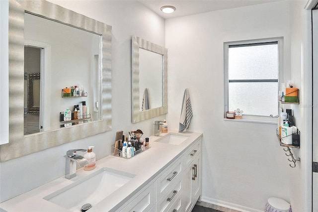 bathroom with double vanity and a sink