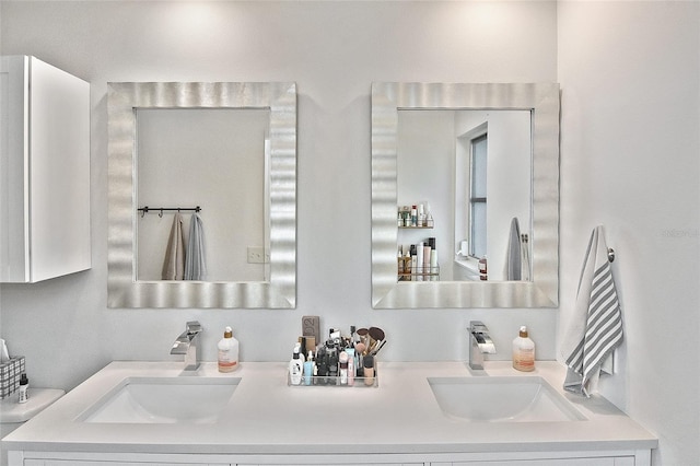 bathroom with double vanity and a sink