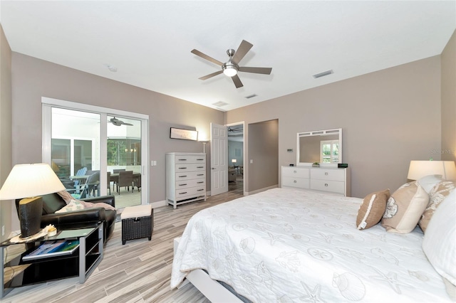 bedroom featuring visible vents, baseboards, light wood-type flooring, a ceiling fan, and access to outside