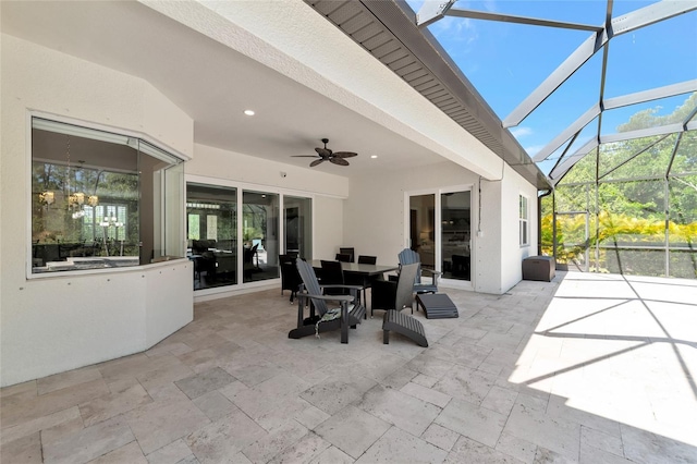 view of patio / terrace with a lanai and ceiling fan