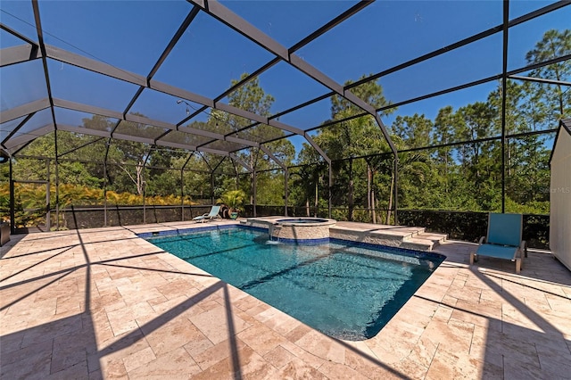 view of pool with a patio, a lanai, and a pool with connected hot tub