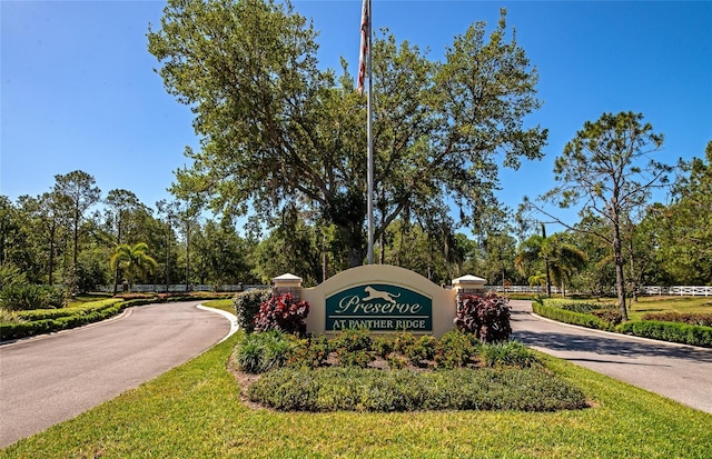 community / neighborhood sign with driveway