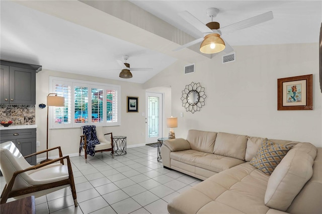 living room featuring vaulted ceiling, light tile patterned floors, a ceiling fan, and visible vents