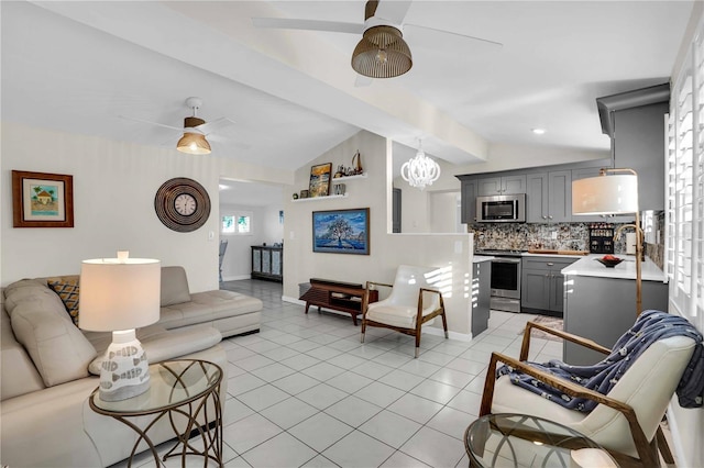 living area with vaulted ceiling, light tile patterned floors, a ceiling fan, and baseboards