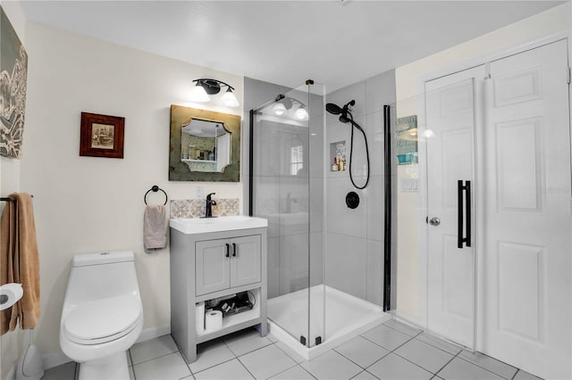 full bathroom with tile patterned floors, toilet, a stall shower, and vanity