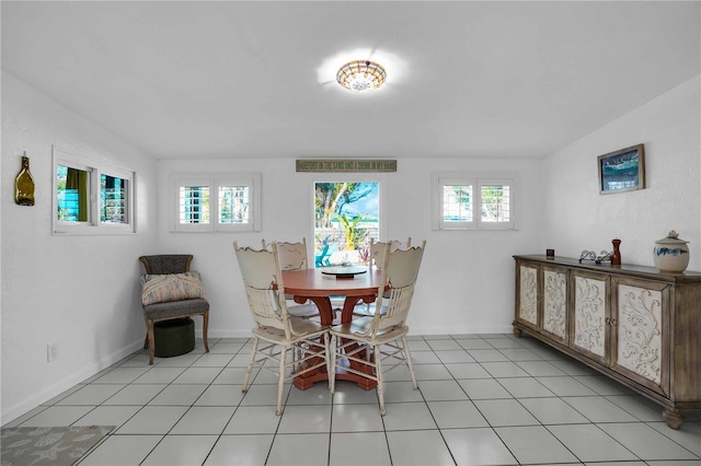 dining space with light tile patterned flooring