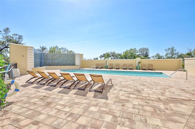 community pool with a patio