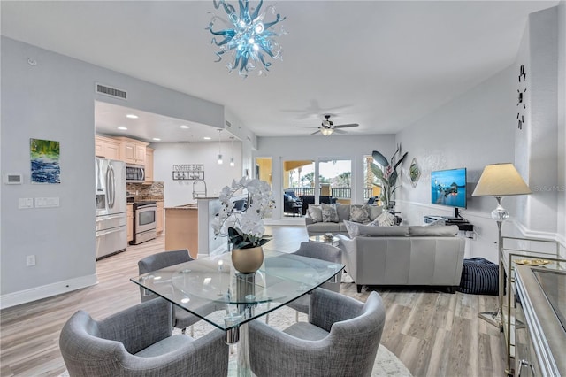 dining space with recessed lighting, visible vents, ceiling fan, and light wood-style floors