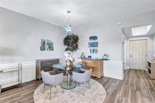 dining room with visible vents and wood finished floors