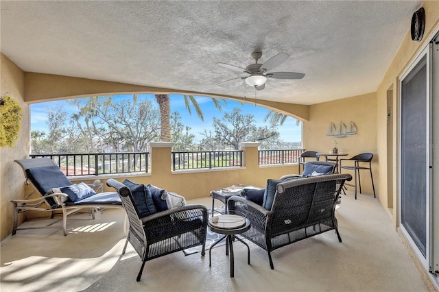 view of patio / terrace with an outdoor living space and ceiling fan