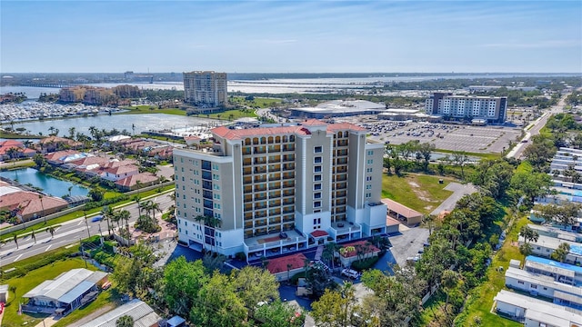 birds eye view of property featuring a view of city and a water view