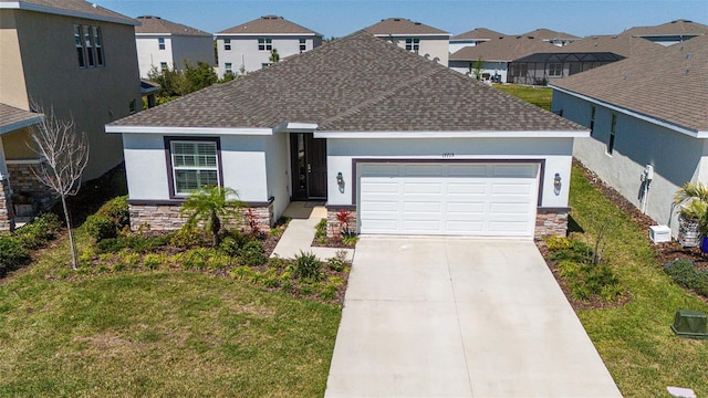 single story home with stone siding, stucco siding, driveway, and a garage