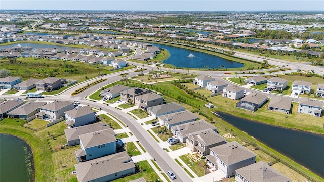 bird's eye view featuring a residential view and a water view