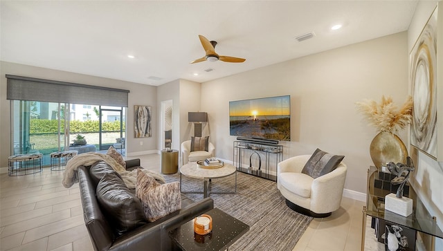 living room with visible vents, recessed lighting, baseboards, and ceiling fan