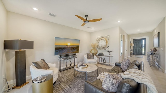 living area featuring recessed lighting, visible vents, baseboards, and ceiling fan