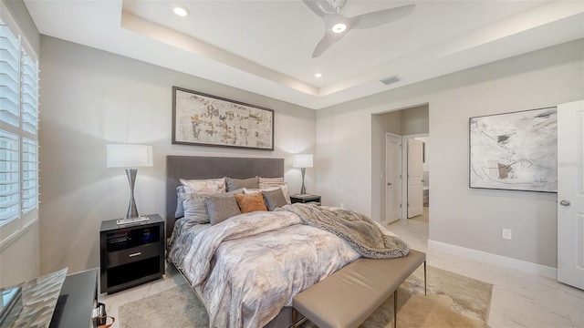 bedroom featuring visible vents, recessed lighting, a raised ceiling, and baseboards