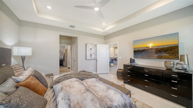 bedroom featuring a ceiling fan, visible vents, recessed lighting, a raised ceiling, and marble finish floor