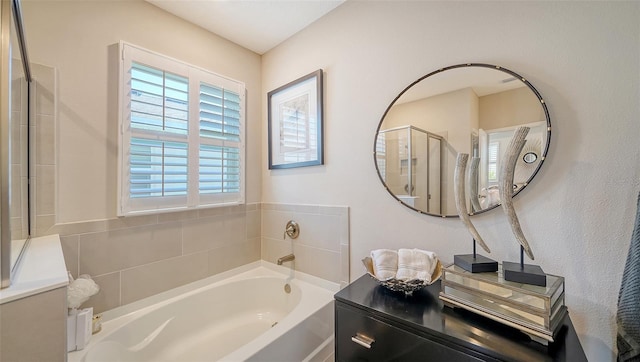 bathroom with a garden tub