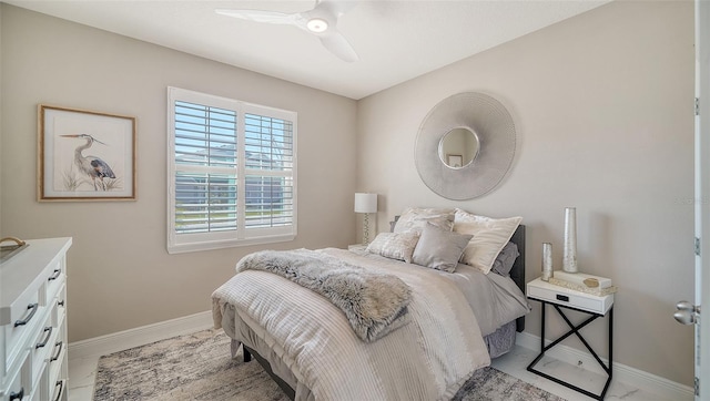 bedroom with baseboards and ceiling fan