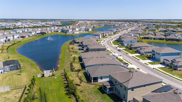 birds eye view of property with a residential view and a water view