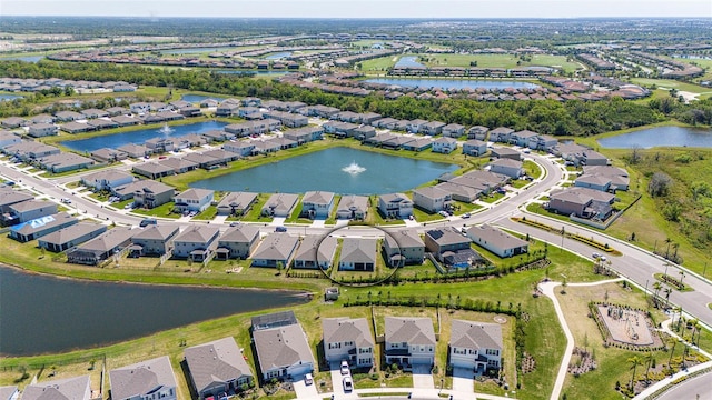 aerial view featuring a residential view and a water view