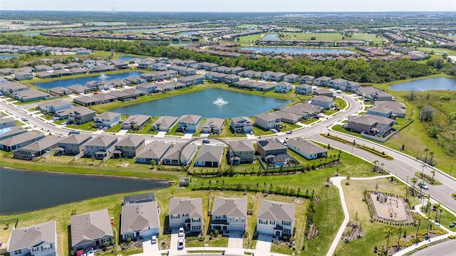 bird's eye view featuring a residential view and a water view