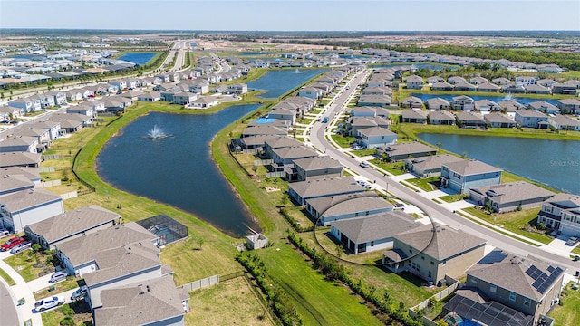 birds eye view of property with a residential view and a water view