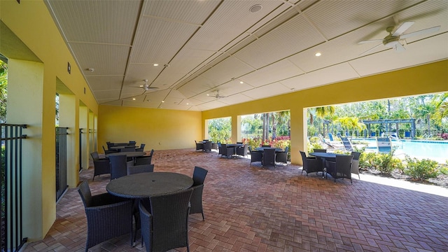 view of patio featuring outdoor dining space and a community pool