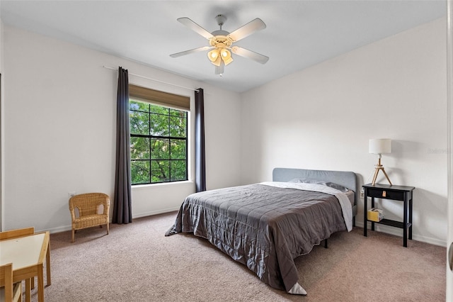 bedroom with carpet flooring, a ceiling fan, and baseboards