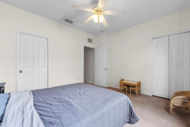 bedroom with visible vents, baseboards, carpet, and a ceiling fan