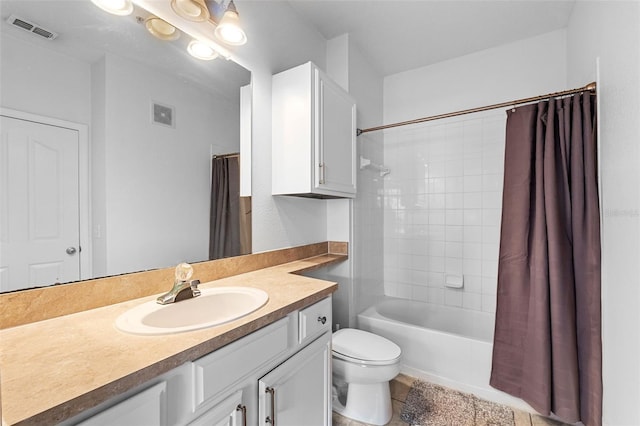 full bath with vanity, shower / bath combo with shower curtain, toilet, and visible vents