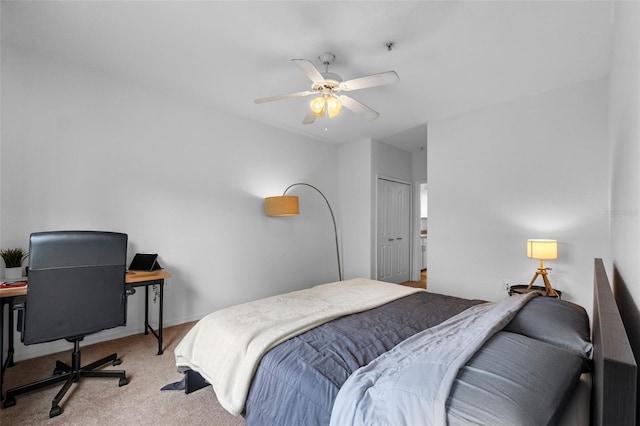 carpeted bedroom featuring a ceiling fan and a closet