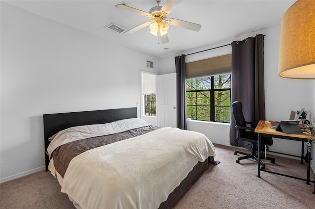 bedroom featuring baseboards, visible vents, carpet floors, and ceiling fan