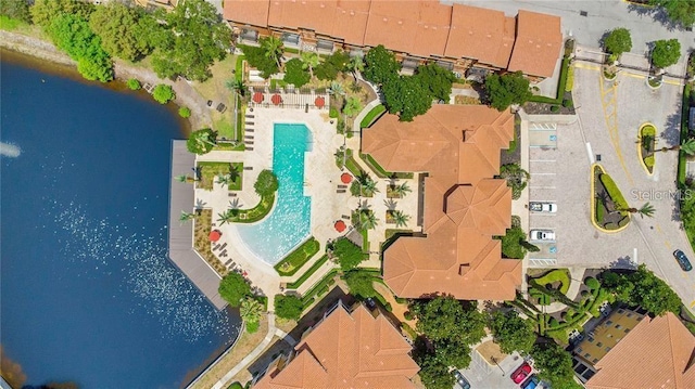 birds eye view of property featuring a water view