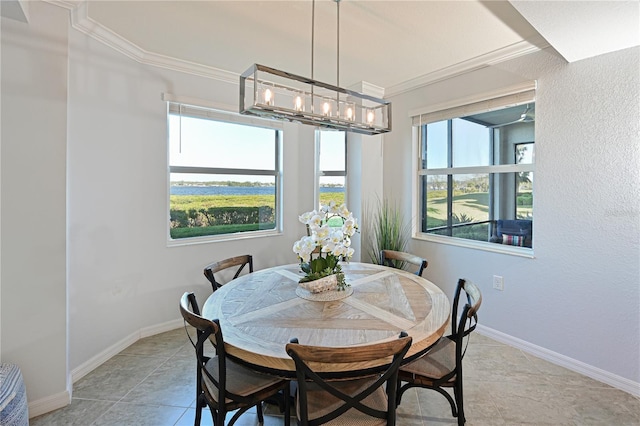 dining space with baseboards and ornamental molding