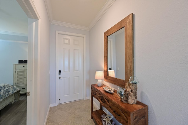 hall with baseboards and ornamental molding