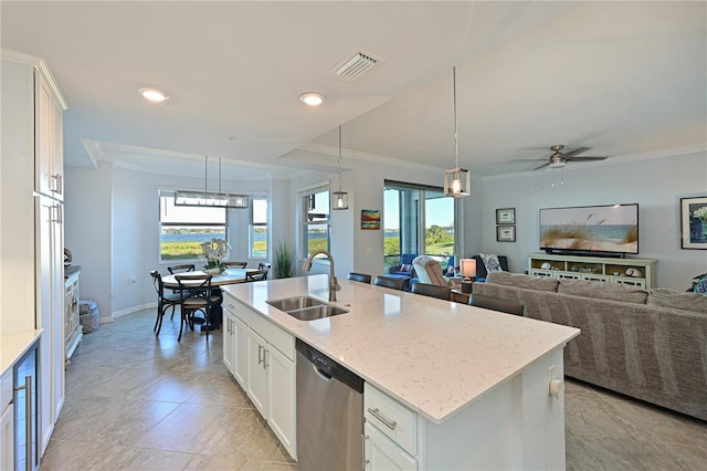 kitchen featuring stainless steel dishwasher, ornamental molding, visible vents, and a sink