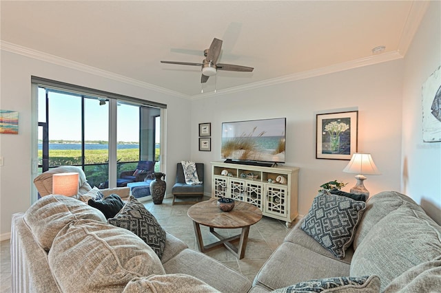 tiled living room with a ceiling fan and ornamental molding