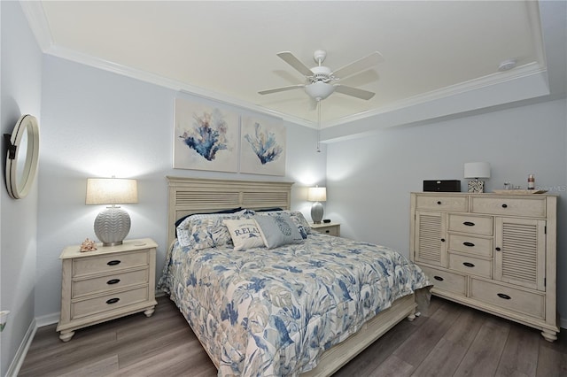 bedroom featuring wood finished floors, ornamental molding, and a ceiling fan