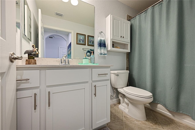 full bathroom featuring tile patterned flooring, visible vents, baseboards, toilet, and vanity