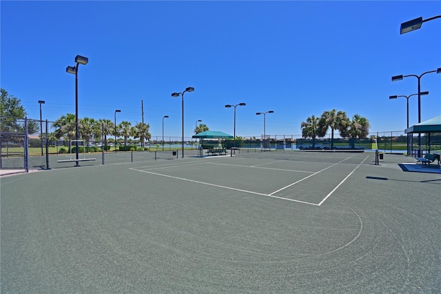 view of sport court featuring a gazebo and fence