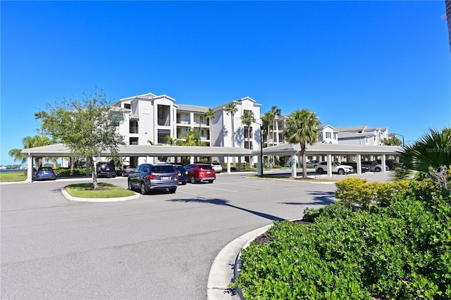 view of building exterior featuring covered parking