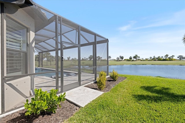 exterior space featuring a yard, a water view, a lanai, and a patio area