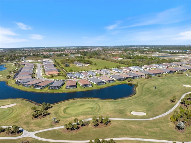 aerial view with a residential view, a water view, and view of golf course