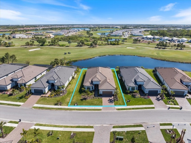 bird's eye view featuring golf course view, a residential view, and a water view