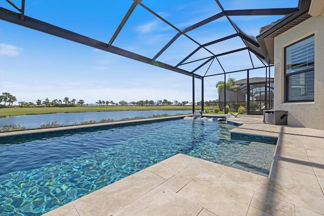 pool with glass enclosure, a patio area, and a water view