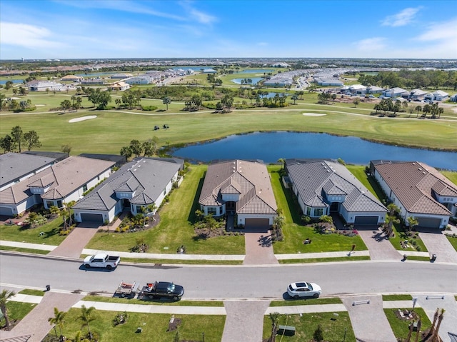 bird's eye view featuring a residential view, golf course view, and a water view