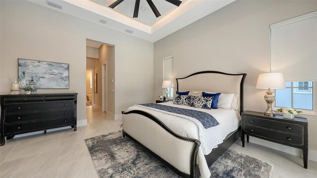 tiled bedroom with visible vents and baseboards