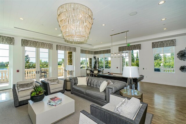 living room featuring recessed lighting, french doors, wood finished floors, and ornamental molding