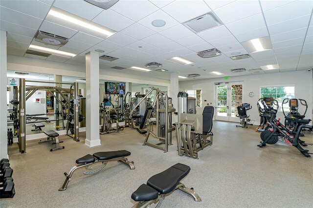 gym featuring visible vents and a paneled ceiling